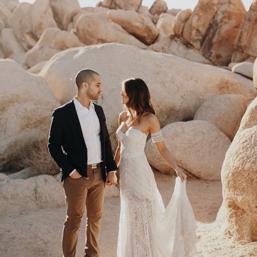 Roxanne and Oliver standing together in the desert