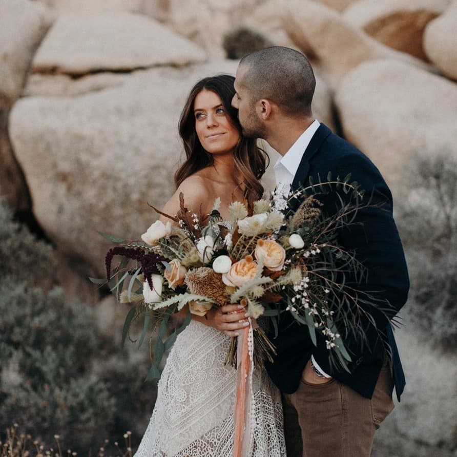 Roxanne and Oliver celebrating with their wedding party