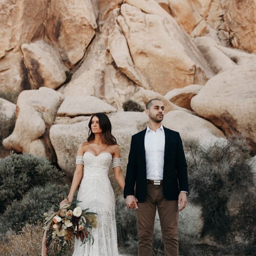 The couple together among the rocks